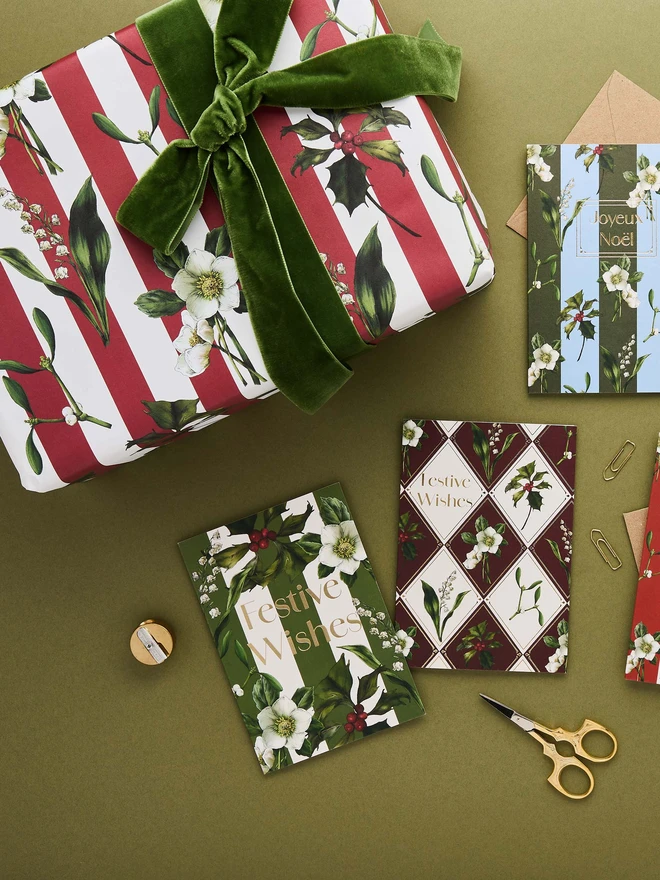 red and ivory stripe pattern with festive botanicals wrapping paper with co-ordinating cards