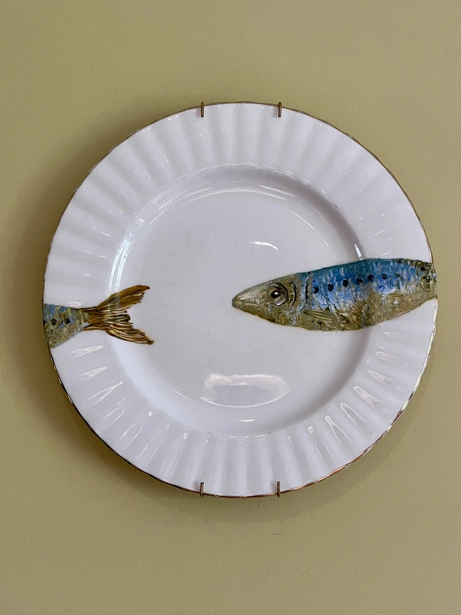 sardine painting on plate