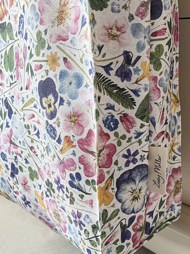 Side view showing the deep gusset of a flower print shopping bag. A great gift for outdoor lovers.