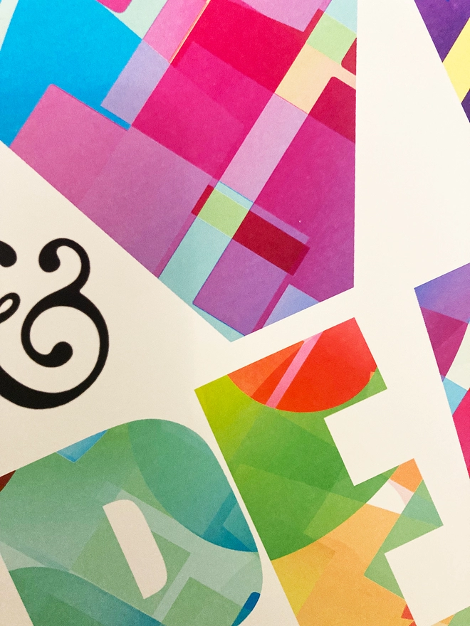 Detail from a multicoloured typographic print of “Peace & Love”
