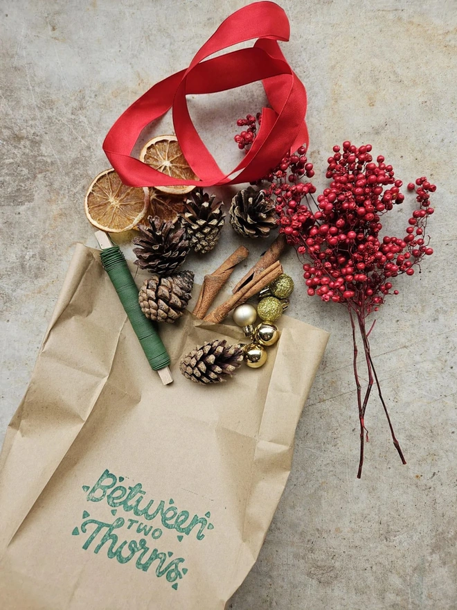 brown paper bag with components needed to make a wreath