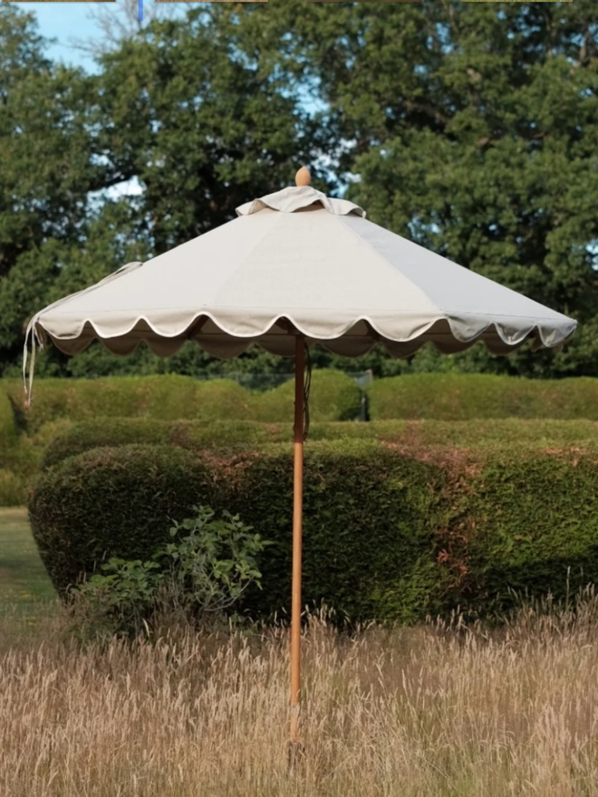 Beige Soft Scallop Parasol. A beige parasol.
