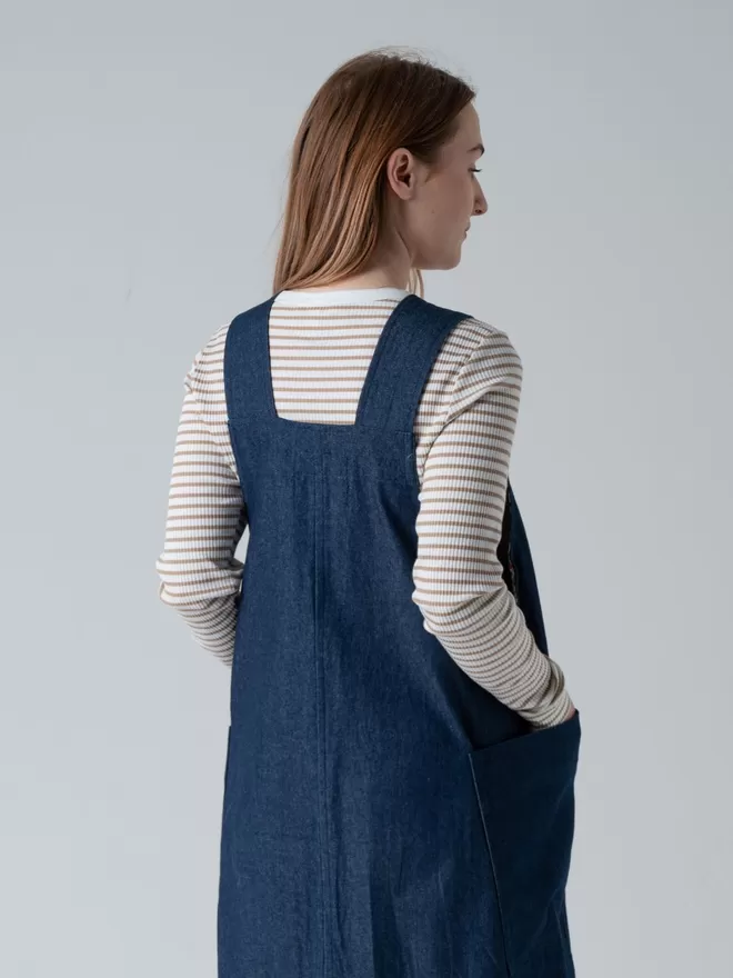 Trapeze line denim pinafore dress  with 2 large patch pockets. Back neck detail.