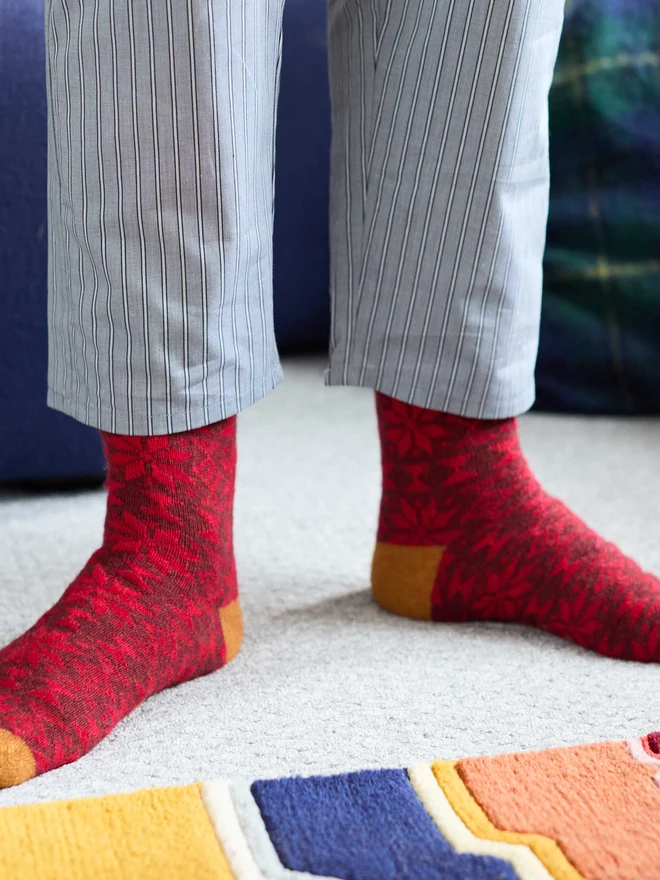 colourful patterned ankle socks, modelled in a colourful room