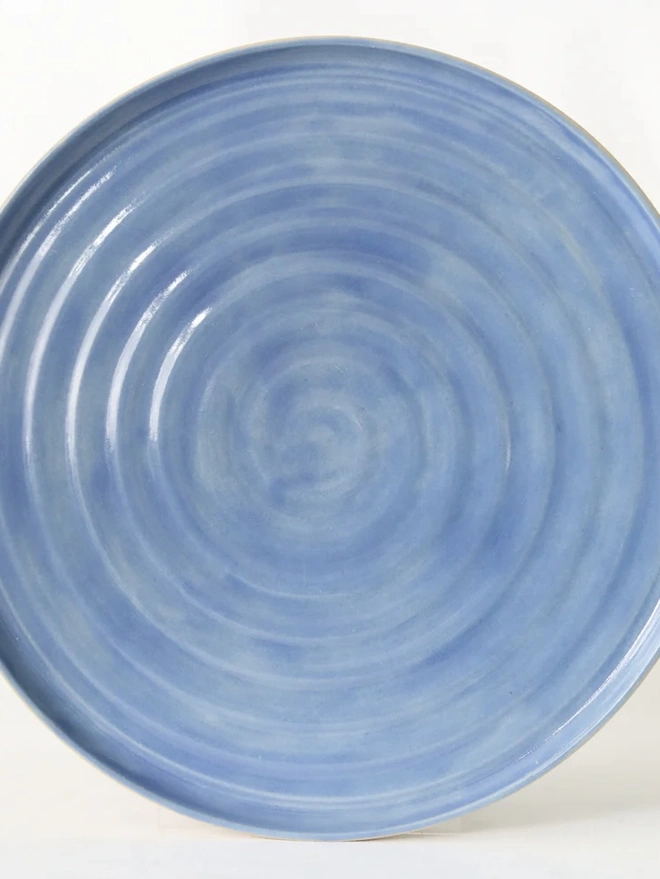 Classic Ceramic Dinner Plate, a colourful ceramic dinner plate sitting on a plain surface against a white backdrop. 