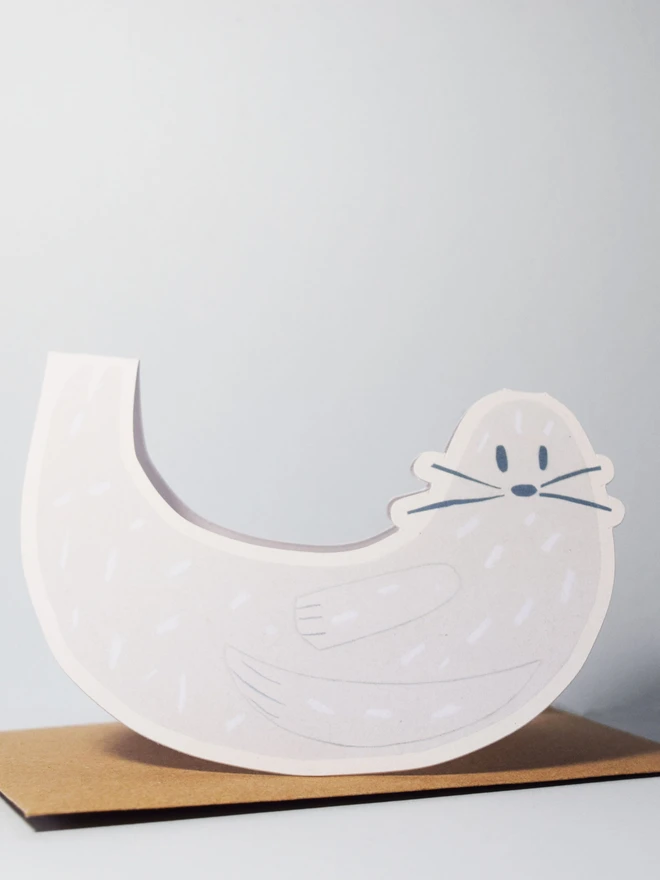 A cut out card of a seal