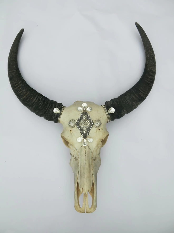 Thai buffalo skull adorned with pearls and vintage diamanté