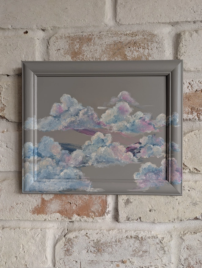 colourful clouds painted on vintage frame