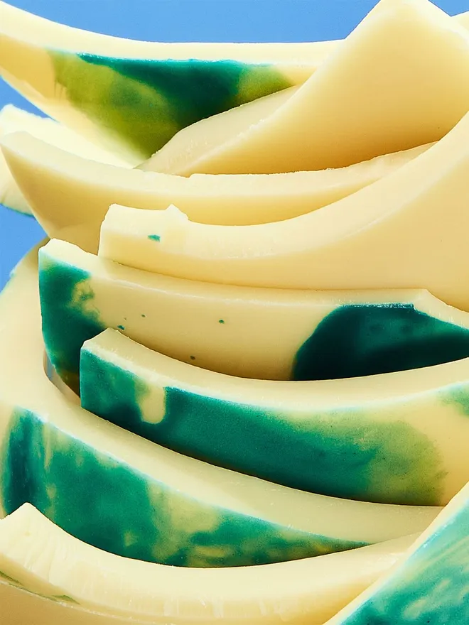 A stack of broken white chocolate Easter egg pieces