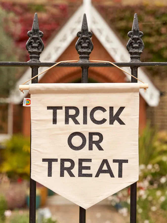 Trick or treat out of sweets reversible Halloween banner