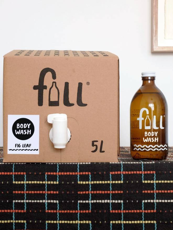 Body Wash. An amber bottle labelled Fill Body Wash next to a 5L refill package.
