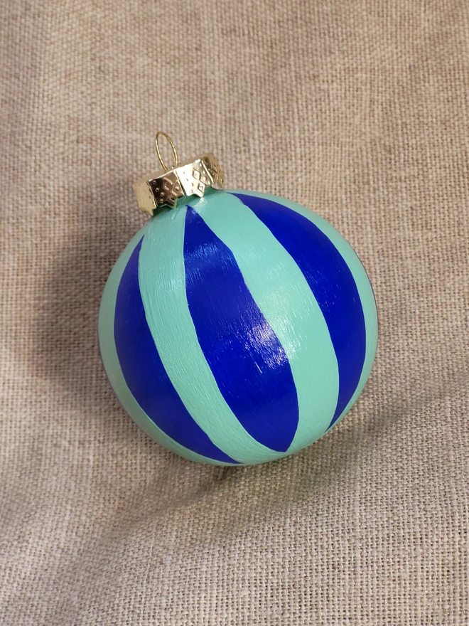 Cobalt blue bauble with mint green stripes