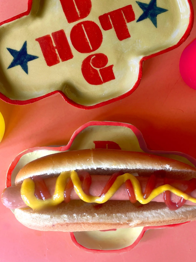Hot Dog Dish. A dish shaped like a hot dog with HOT DOG written on it.