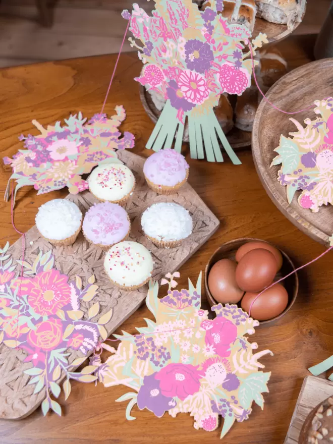 Pink bouquets with easter eggs and cakes