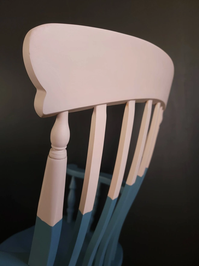 Close up of a dusty pink and blue rockin chair by Orange Otter Design