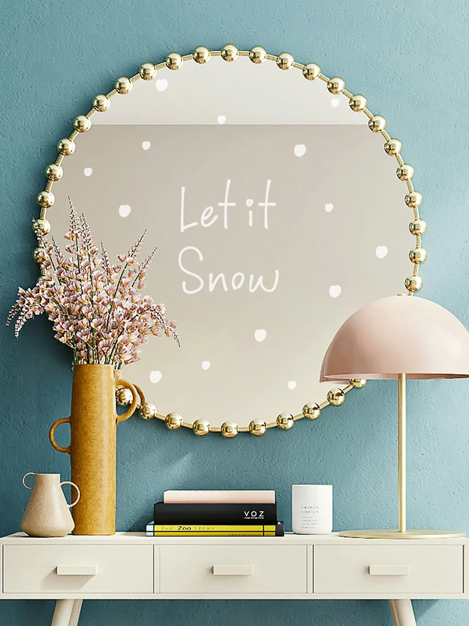 let it snow wall sticker on a mirror