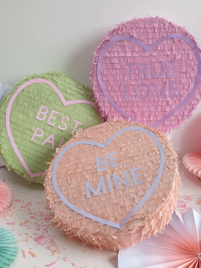 Collection of love heart sweet pinatas. pink true love, mint best pal and peach be mine. 