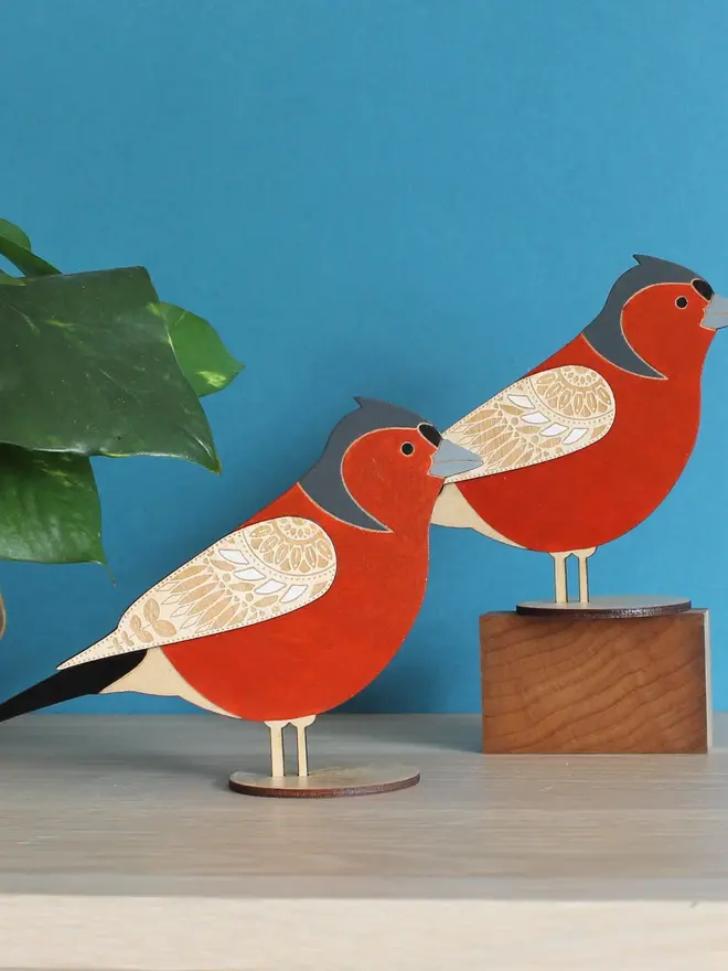 Standing Wooden Chaffinch, red wooden bird decoration standing on a platform. 