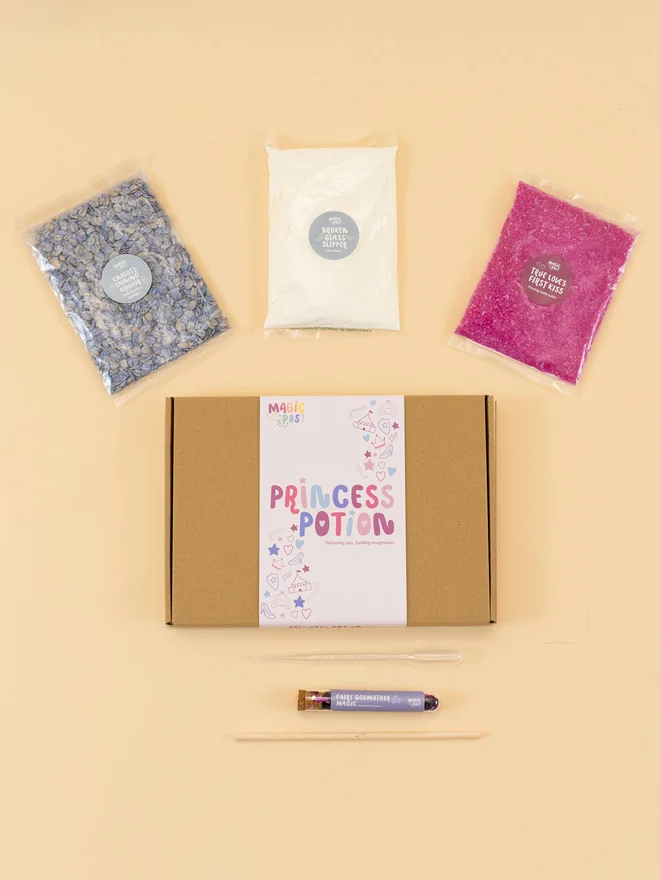 princess mini sensory potion kit. three bags of assorted sensory materials placed around a cardboard box.
