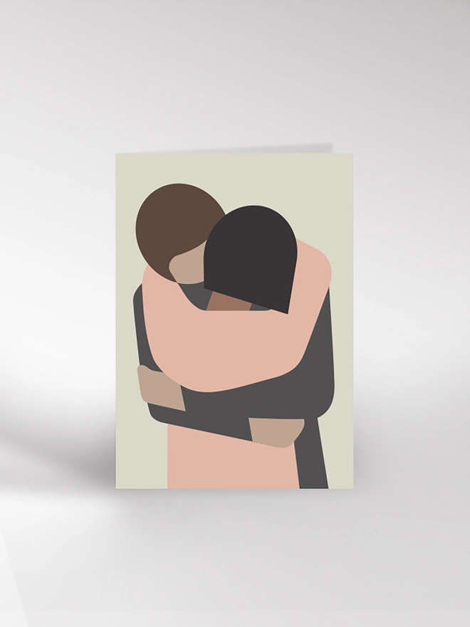 A card featuring a contemporary illustration of a couple hugging