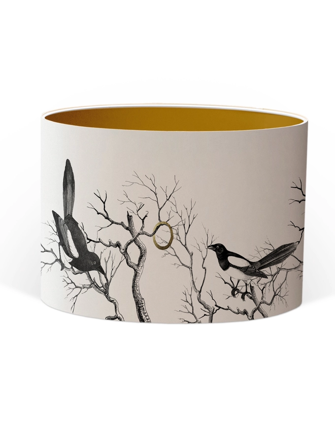 Drum Lampshade featuring magpies sitting on branches with a Gold inner on a white background