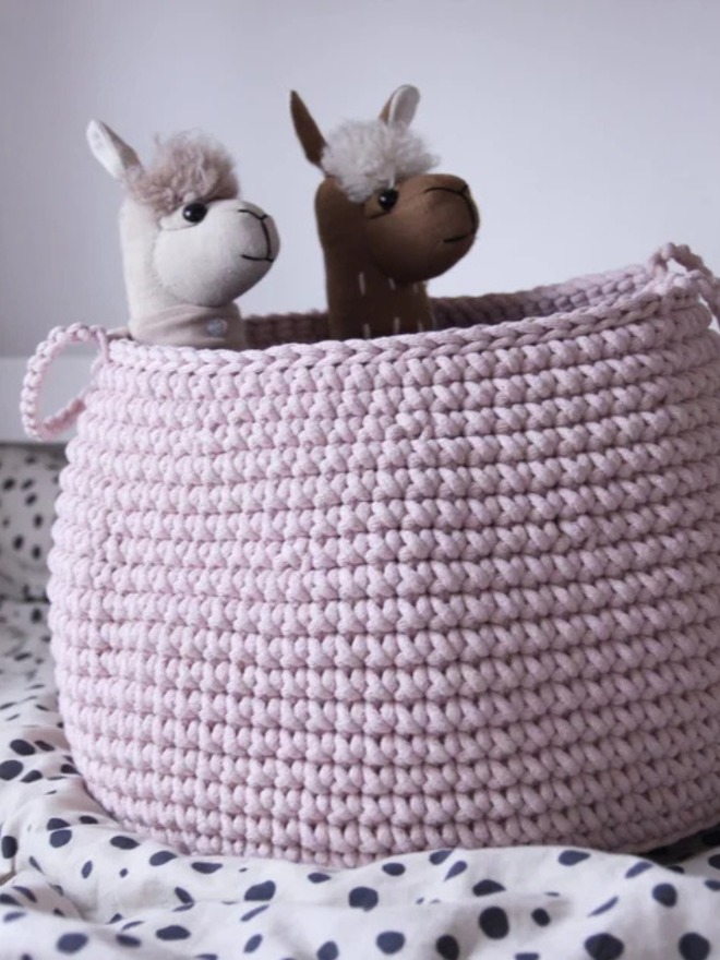 Zuri House. L pale pink basket.