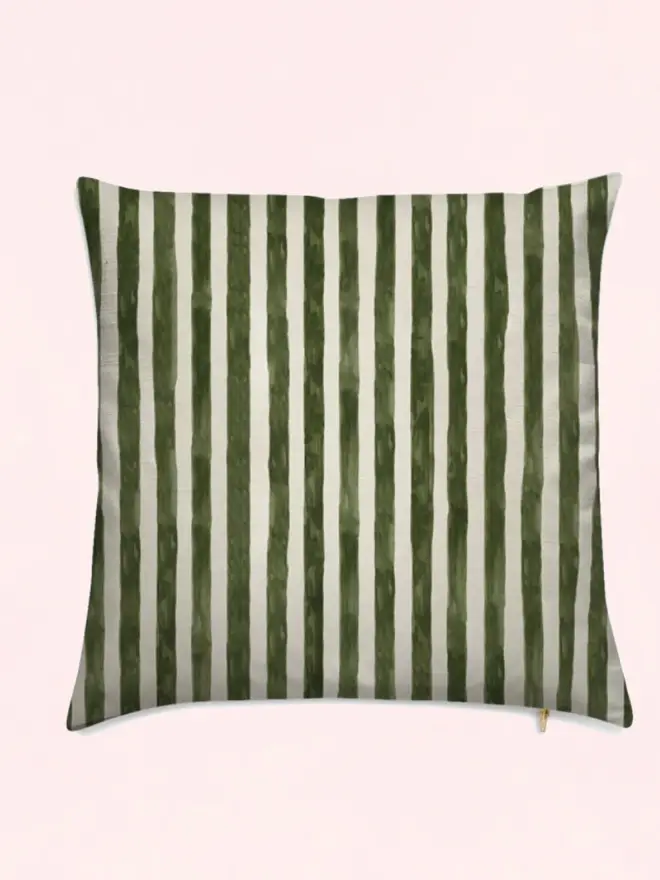 sun stripe cushion. a green and white striped cushion.