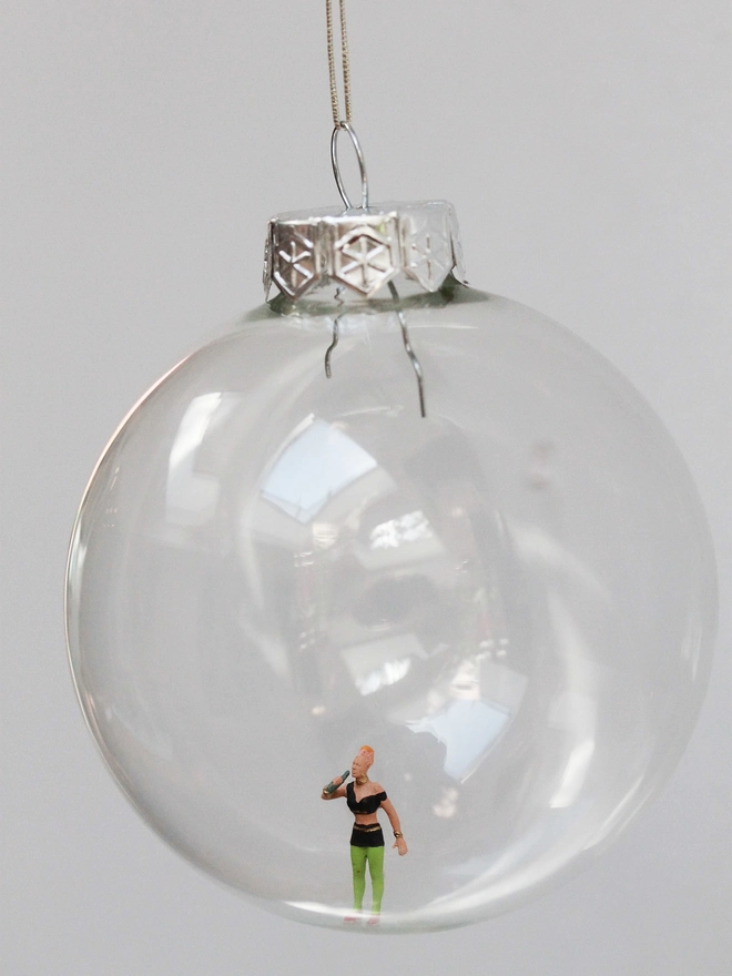 Miniature figure of a female punk in a glass hanging christmas bauble 