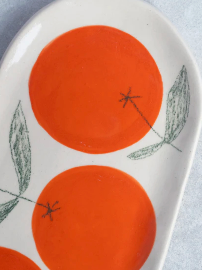Large Orange Dish. A large dish with an orange design.