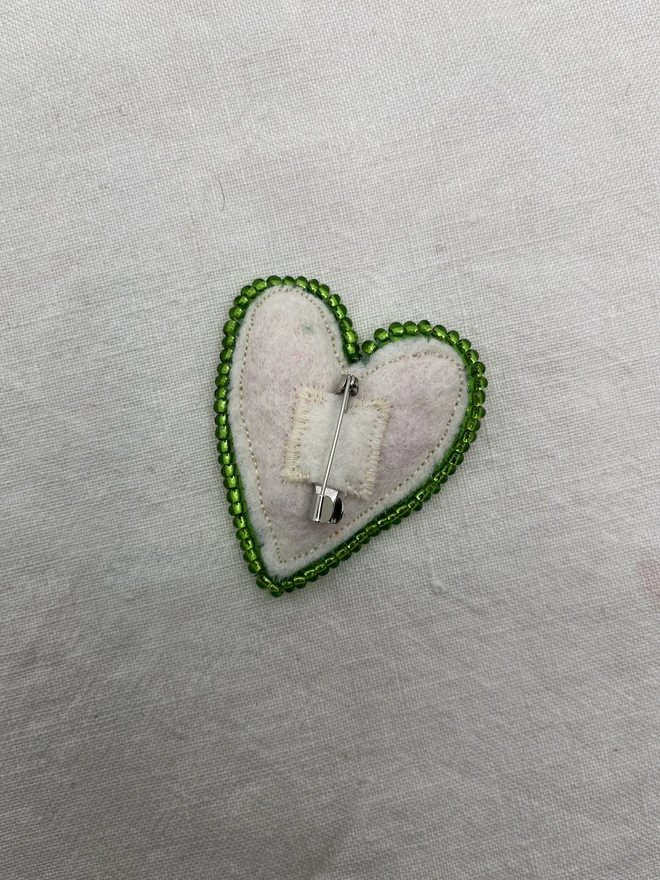 green beaded brooch clasp and back