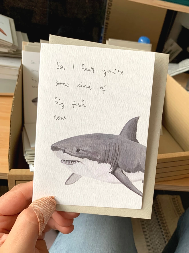 a greetings card featuring a great white shark with the text "so, I hear you're some kind of big fish now"