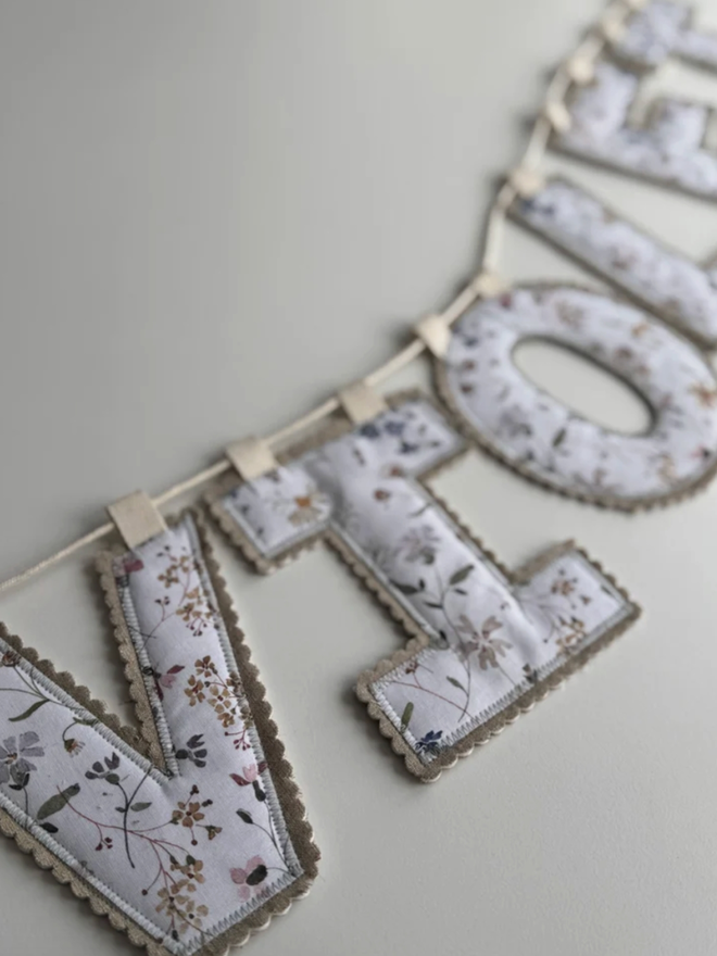 Name Garland. A garland spelling Violet.