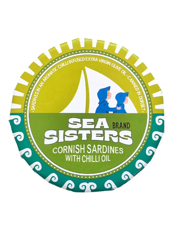 A closed tin of Sea Sisters Cornish Sardines with Chill Extra Virgin Olive Oil on a white background