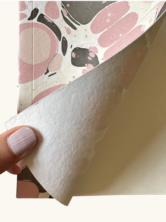 inside cover of pink marbled notebook