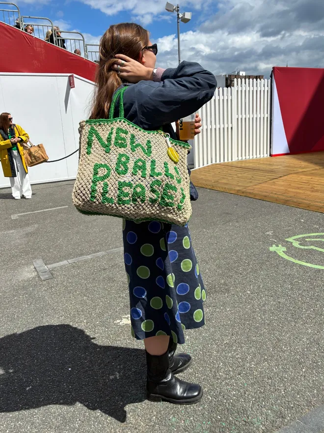 Girl holding new balls please Jacksons tote bag