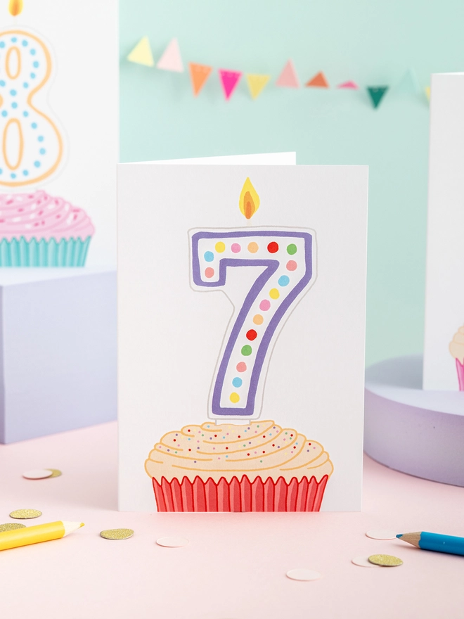 A sweet seventh birthday card featuring a cupcake and candle