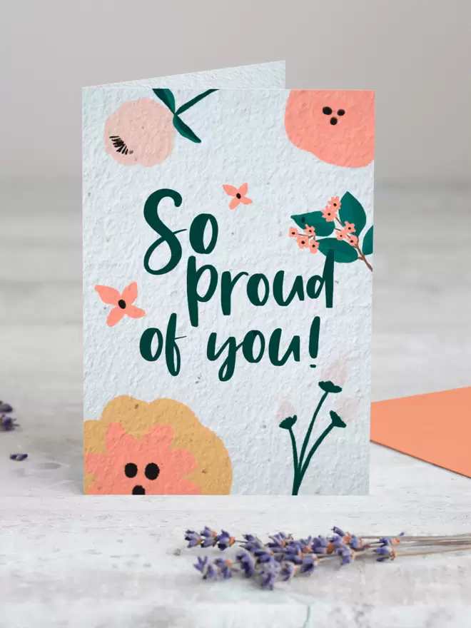 Plantable Card with ‘So Proud of you’ with floral illustrations with a sprig of Lavender in the foreground