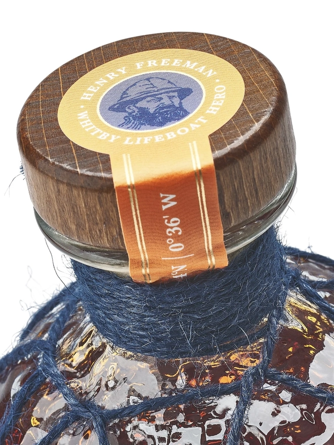 Whitby Dark Spiced Rum - RNLI Edition, a bottle of rum sitting on a plain white surface. 