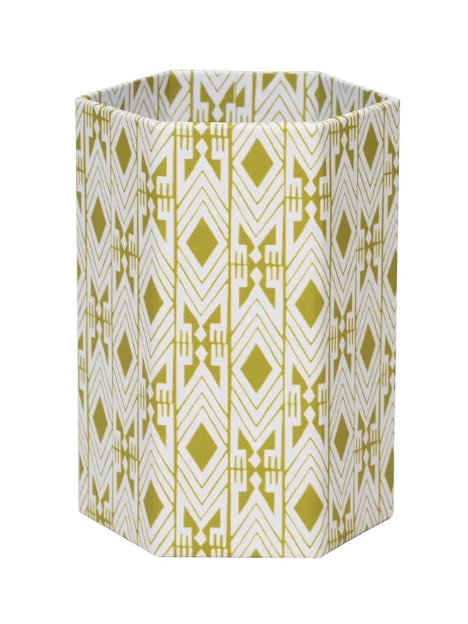 Tijan Hexagonal Brush Pot, a colourful patterned pencil pot sitting on a white surface against a plain backdrop.