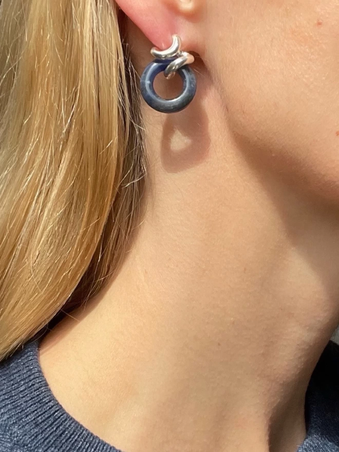 Iconic Rollo earrings reimagined in sterling silver and navy blue sodalite crystal