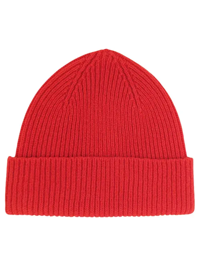 Ribbed Lambswool Women's Beanie, a colourful beanie sitting on a white plain surface. 