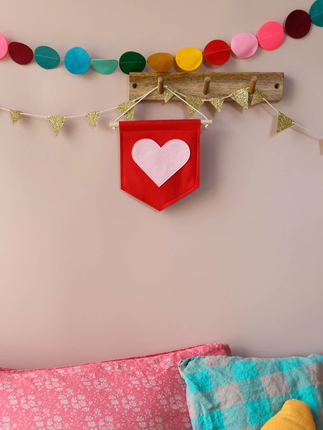 red mini felt banner with baby pink heart sewn on .