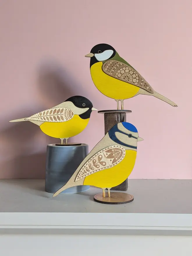 Standing Wooden Great Tit, group of wooden birds standing on platforms. 