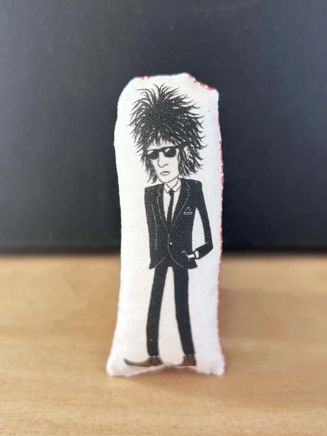 Mini fabric doll featuring an illustration of punk poet John Cooper Clarke.