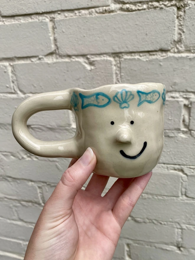 fish and shell mug