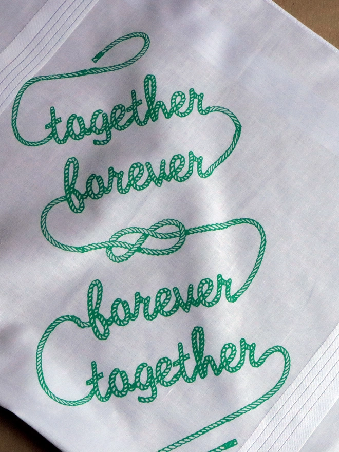 A Mr.PS Together Forever hankie printed in green