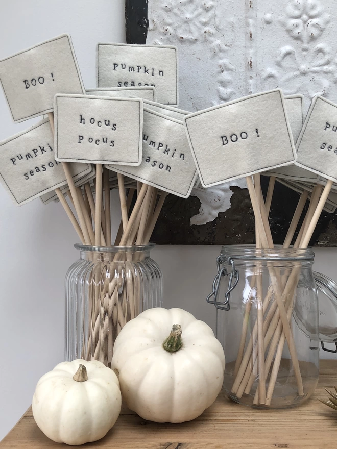 Halloween Embroidered Signs in vases with pumpkins