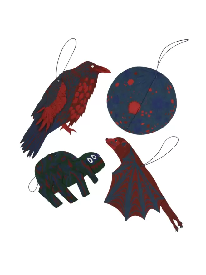 White cut-out shot: moon, bat, spider and crow using the halloween colours of red and blue