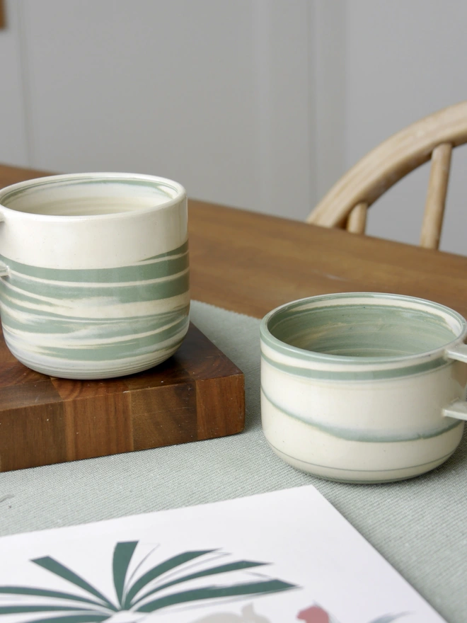 Small and large handmade green and white marble mugs
