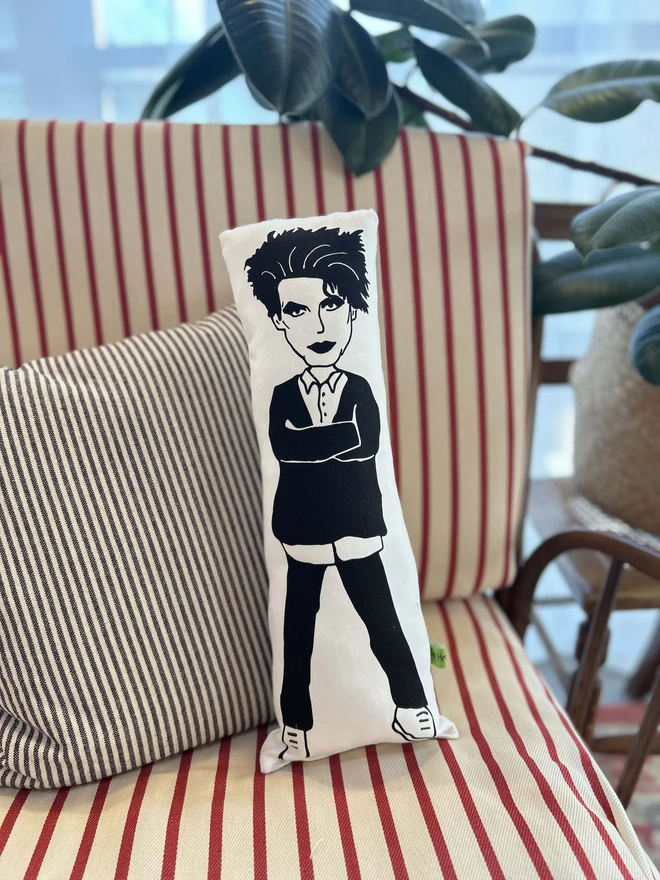 Illustrated cushion featuring Robert Smith